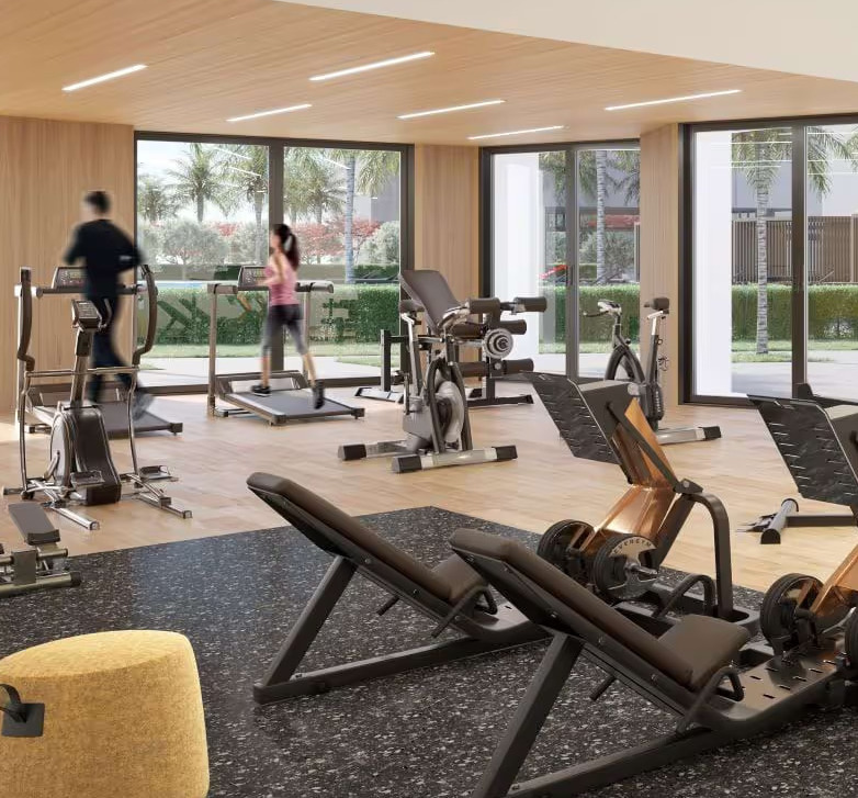 State-of-the-art fitness center at Design Quarter d3 with premium equipment, large windows, and modern design